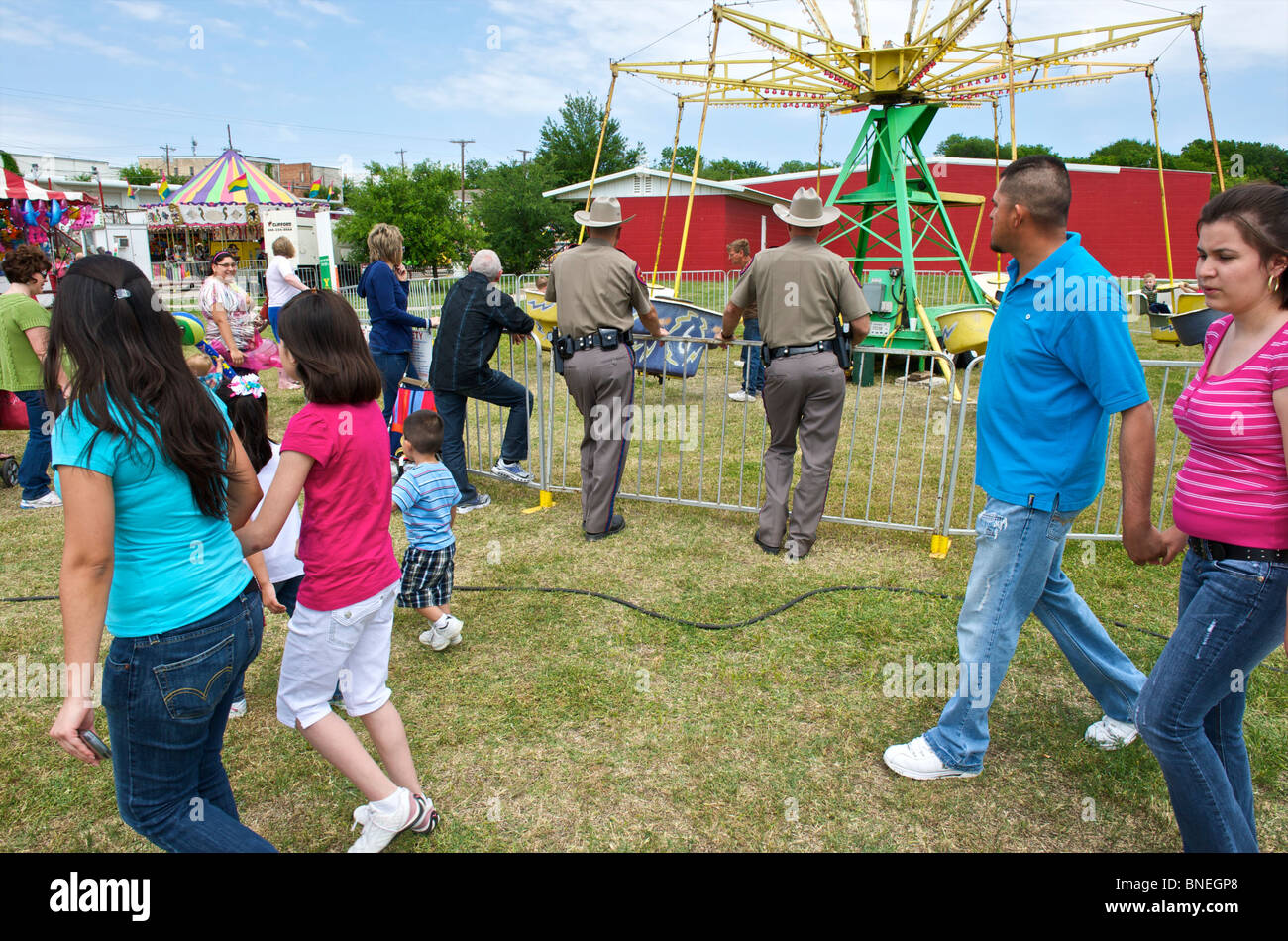 Police officers on duty at funfair in Texas, USA Stock Photo