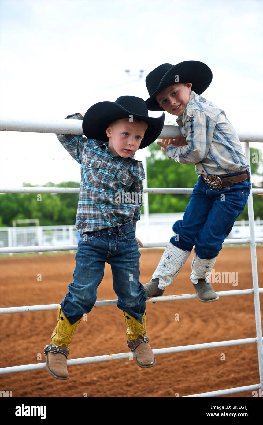Two kids playing in small-town PRCA rodeo Bridgeport, Texas, USA Stock Photo