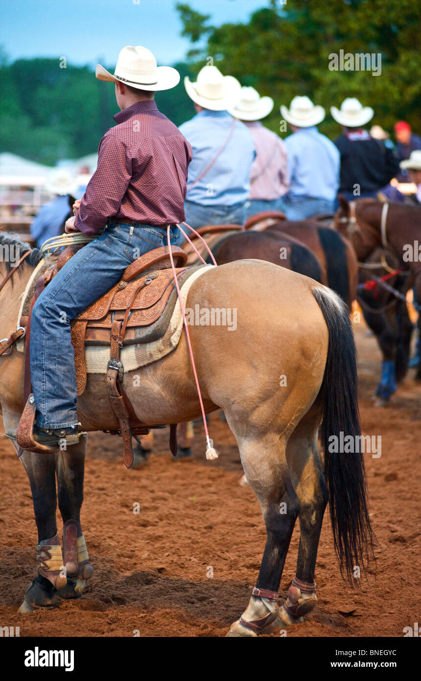 Cowboy members of PRCA riding horses  at rodeo event in Bridgeport, Texas, USA Stock Photo