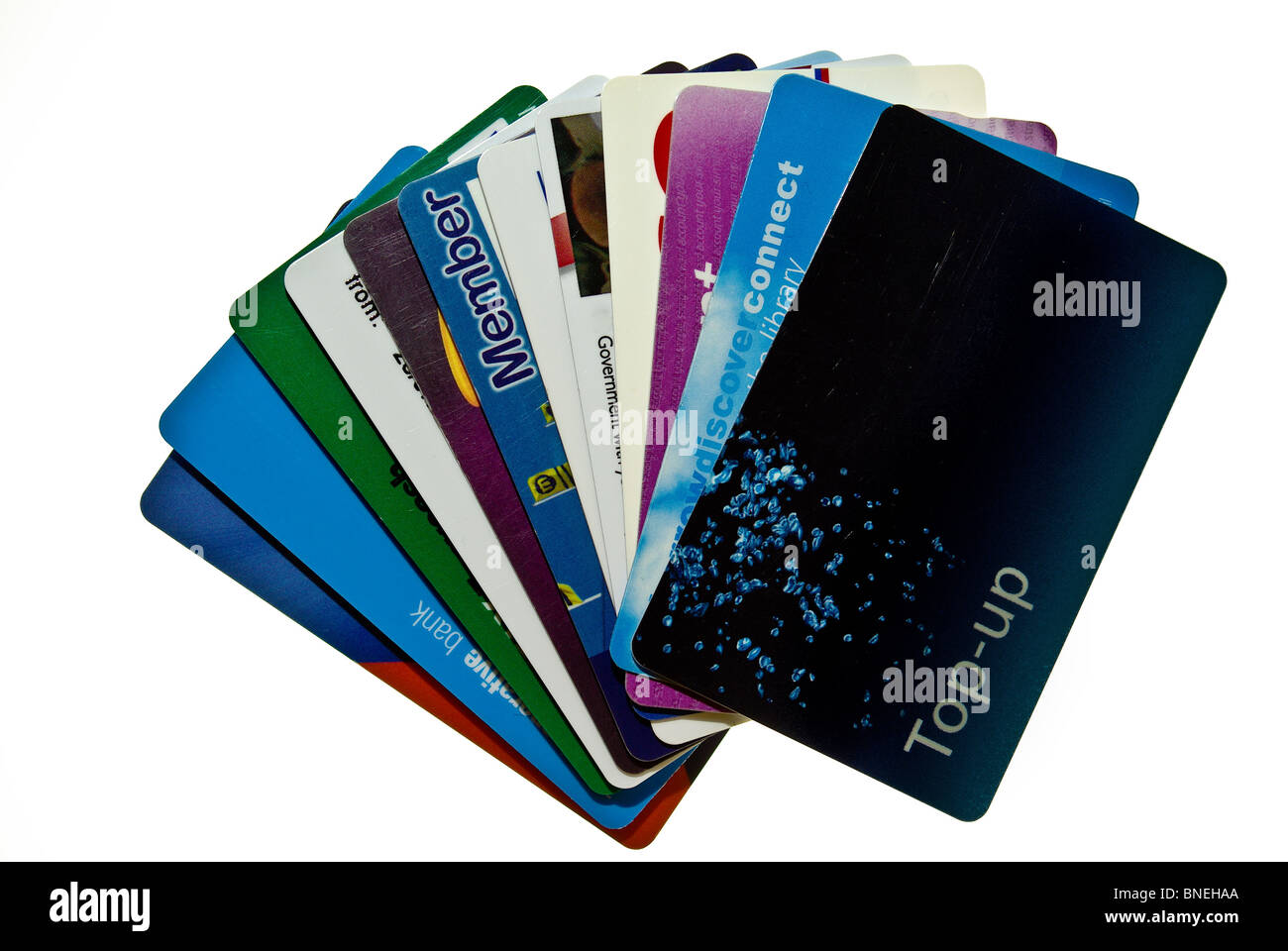 Credit, Debit and Store cards in a fan shape isolated on white Stock Photo