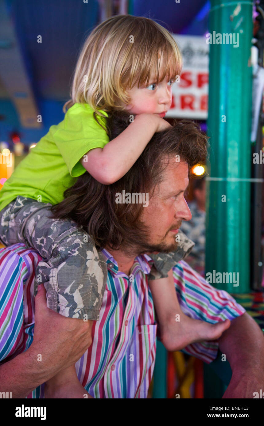 Father with three year old son on his shoulders, Texas, USA Stock Photo