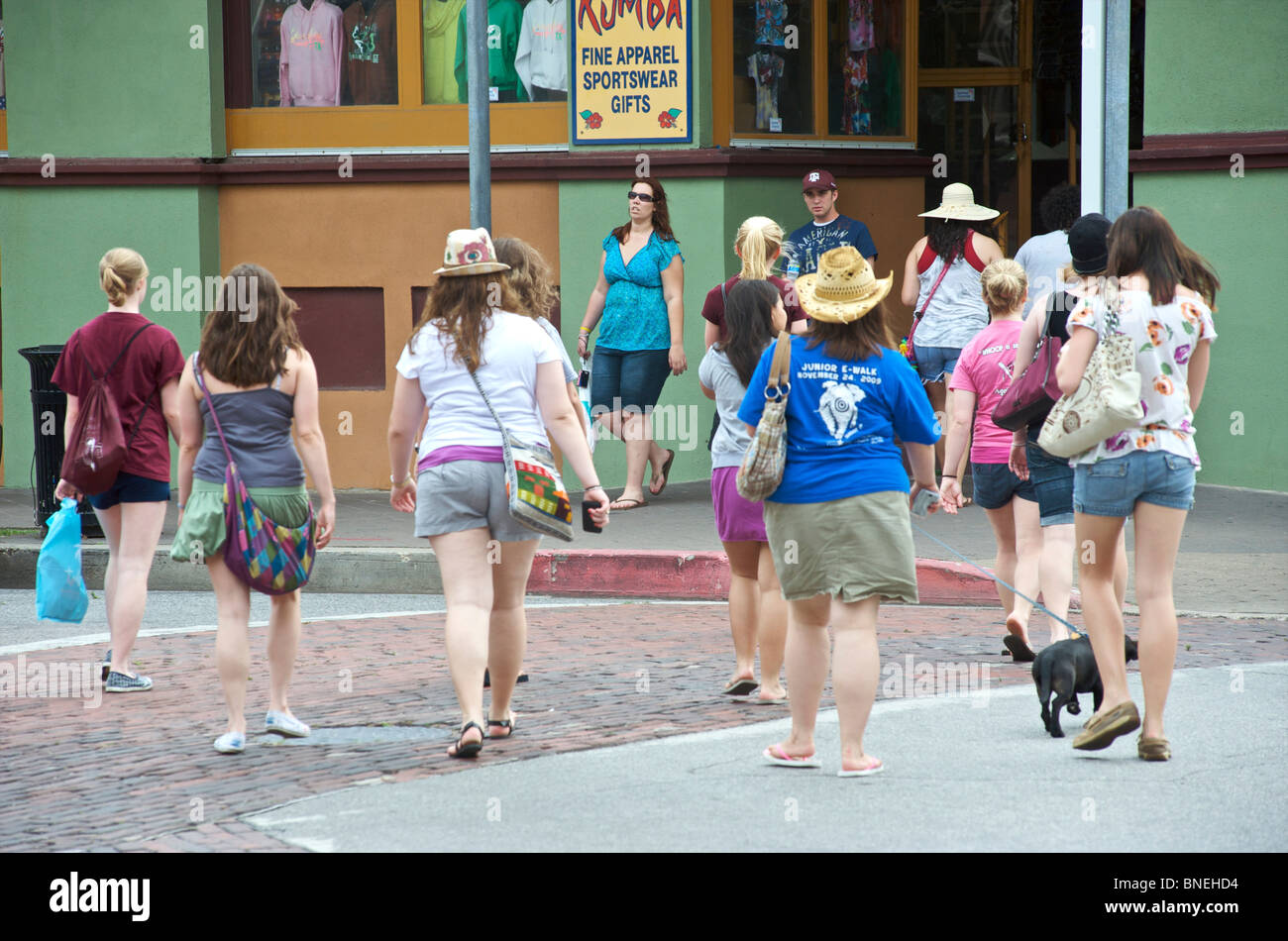 Overweighed ladies walking into store in USA Stock Photo