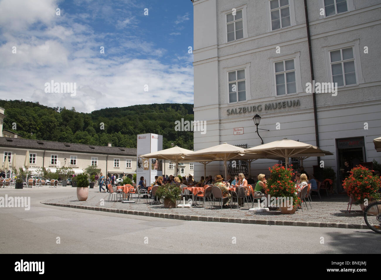 Salzburg Austria EU Tourists sitting out in the Museum pavement cafe Stock Photo