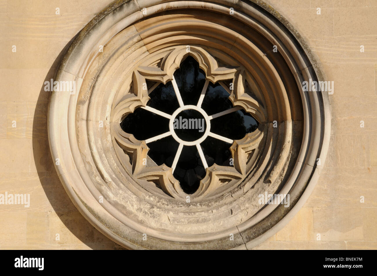 Carved ornamental limestone circular window in an listed historic ...