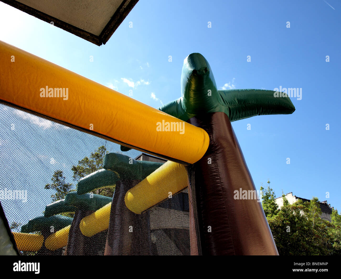 children's jumping balloon enclosure with sky in background abstract