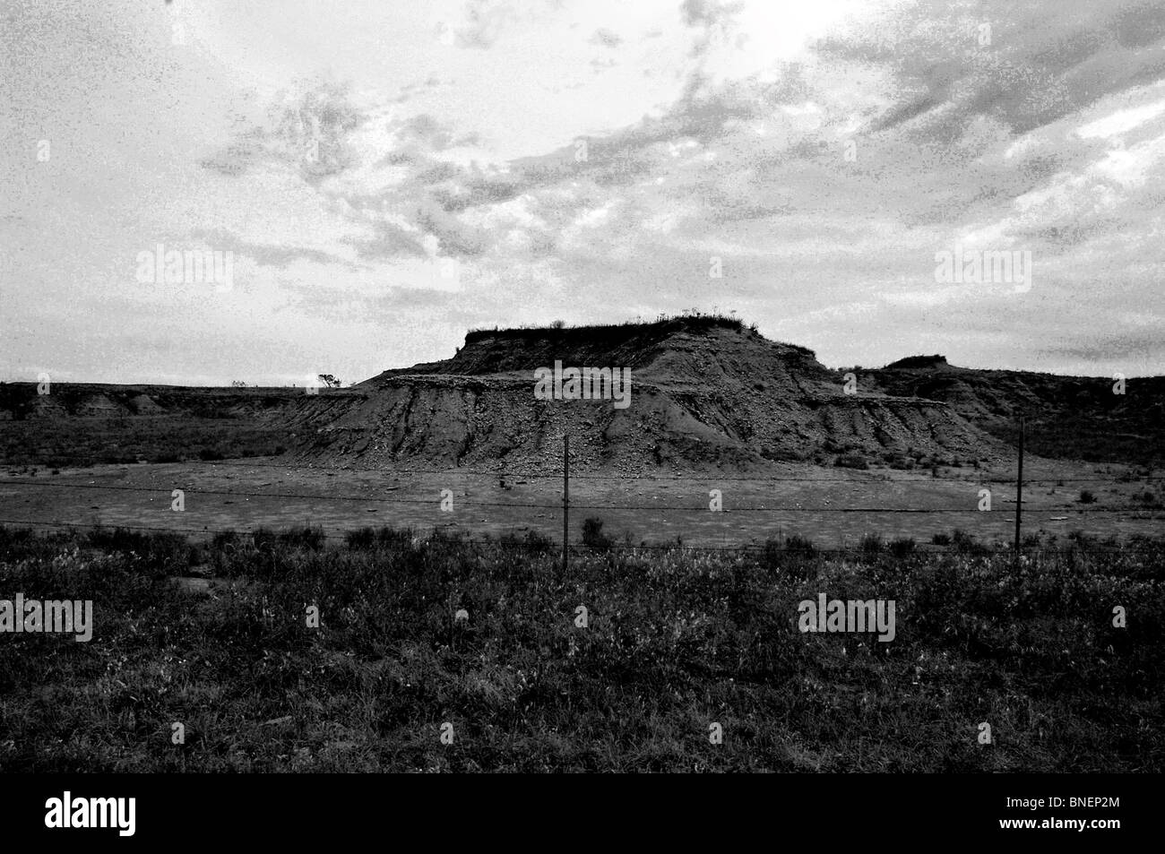 US heartland includes, farmscapes, ranch land, dusty roads, grass lands, cattle, horses, red clay, red dirt and desolate areas Stock Photo