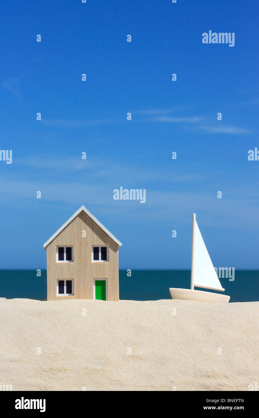 Model house and sailboat Stock Photo
