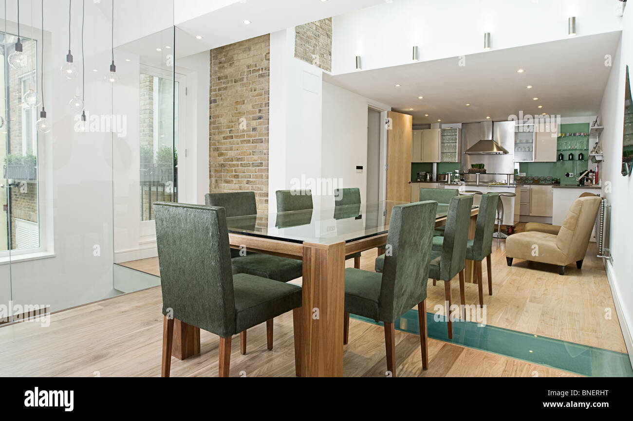 Shot of a Stunning Modern Luxury Interior of Dining Area with Open Plan Kitchen Stock Photo