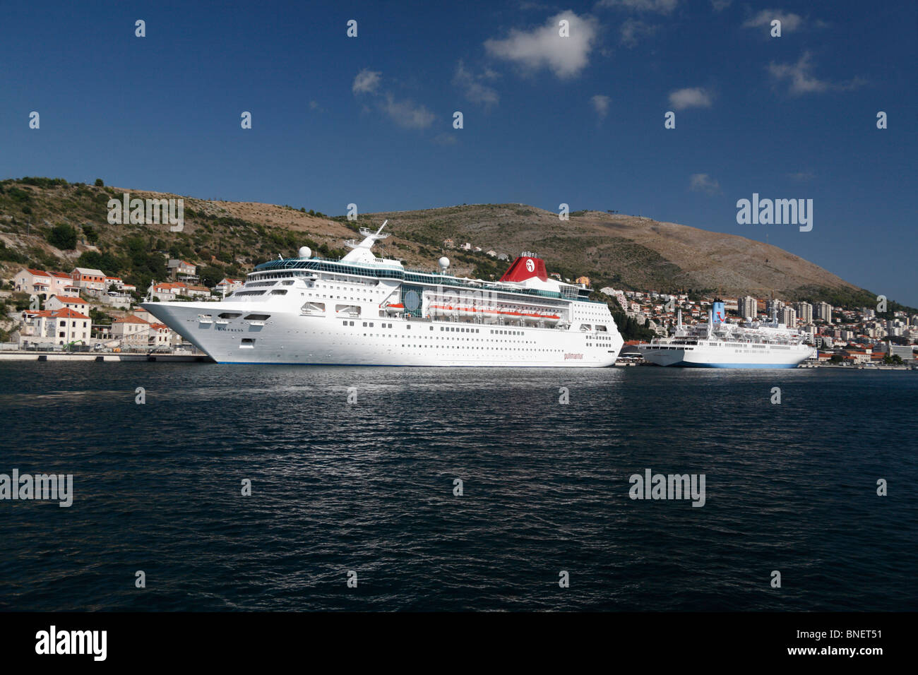 Pullmantur cruise ship ocean luxury liner Empress moored in dock at Dubrovnik harbour Croatia ships Thomson Celebration in rear. Stock Photo
