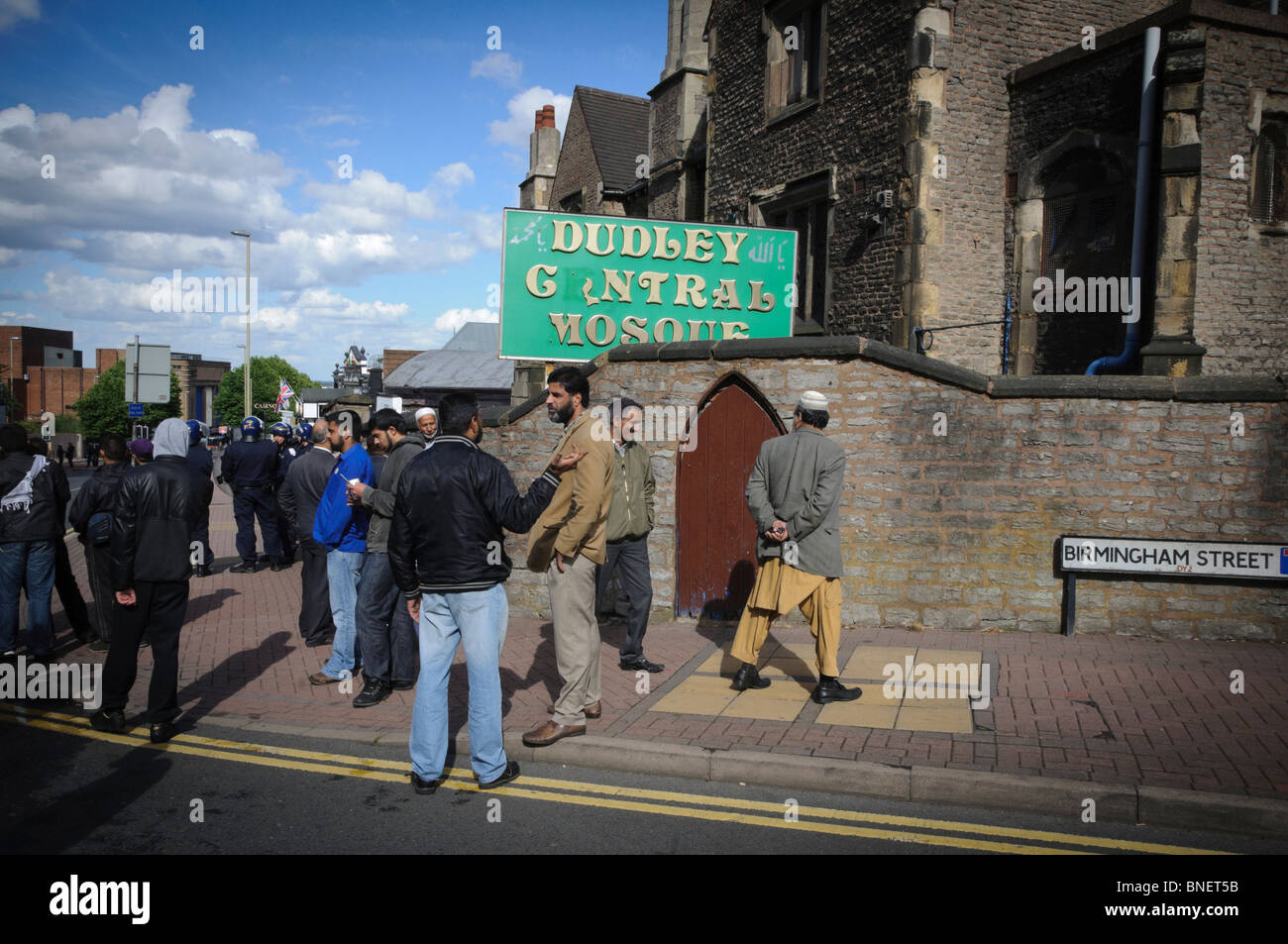 Muslim leaders and youths protect Dudley's Central Mosque from potential attack by the English Defense League (EDL) during the E Stock Photo