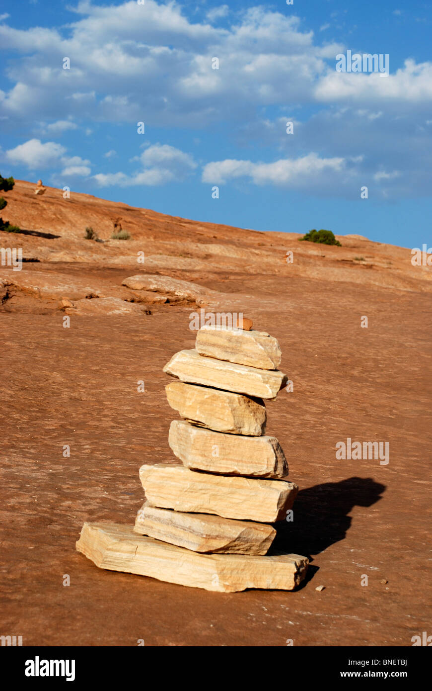 Rock pile trail marker on rocky surface near Delicate Arch in Arches National Park, Utah, USA Stock Photo