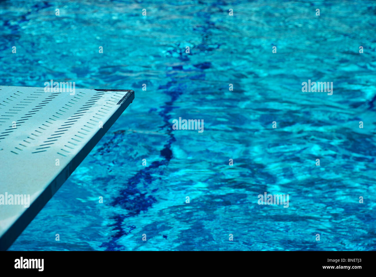Diving board and swimming pool Stock Photo