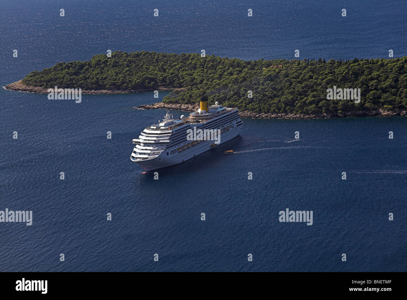 Cruise ship moored off Lokrum island Dubrovnik Croatia, tenders ferrying tourists to city Stock Photo