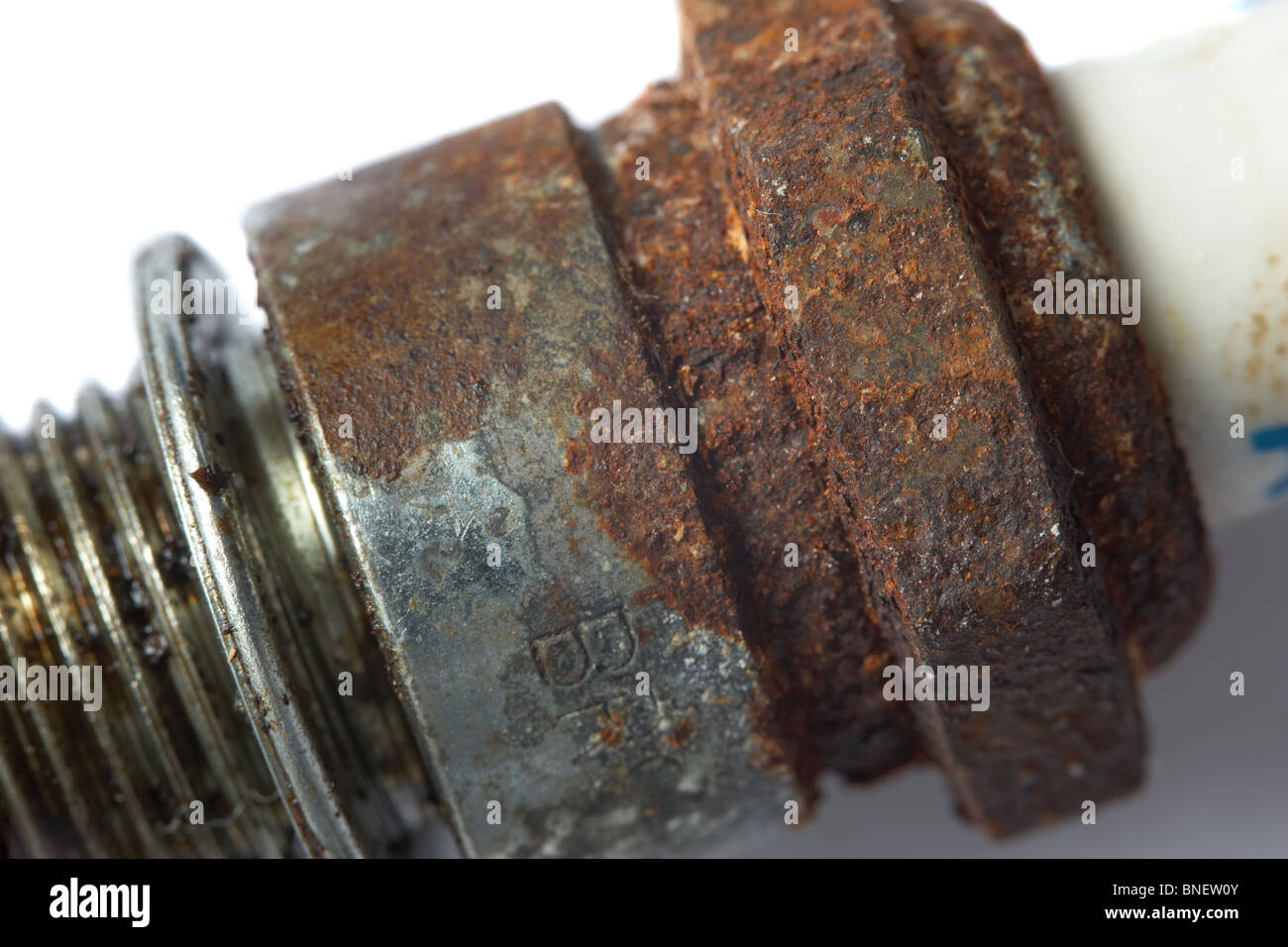 close up macro photograph of rust on a spark plug Stock Photo