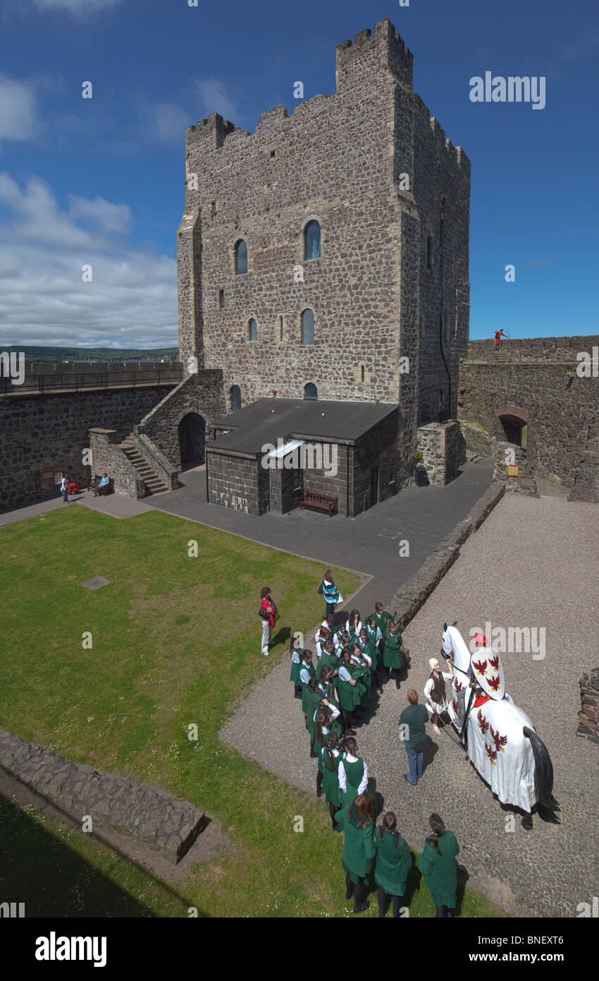 schoolgirls on educational visit to Carrickfergus castle, Northern Ireland, UK Stock Photo