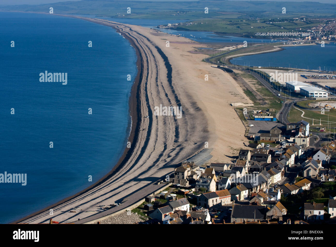 Visit-Dorset - A fantastic shot over Chesil Beach and the Fleet Nature  Reserve. 💦⁠ Chesil beach is a bank of pebbles stretching for 18 miles  along the Dorset Coast. Trapped behind this