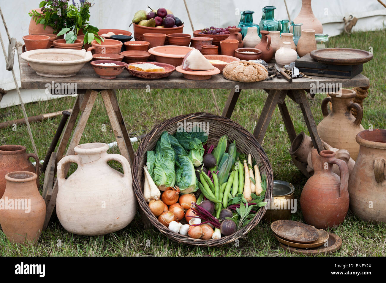 Table of wine and food in a roman camp re enactment. UK Stock Photo