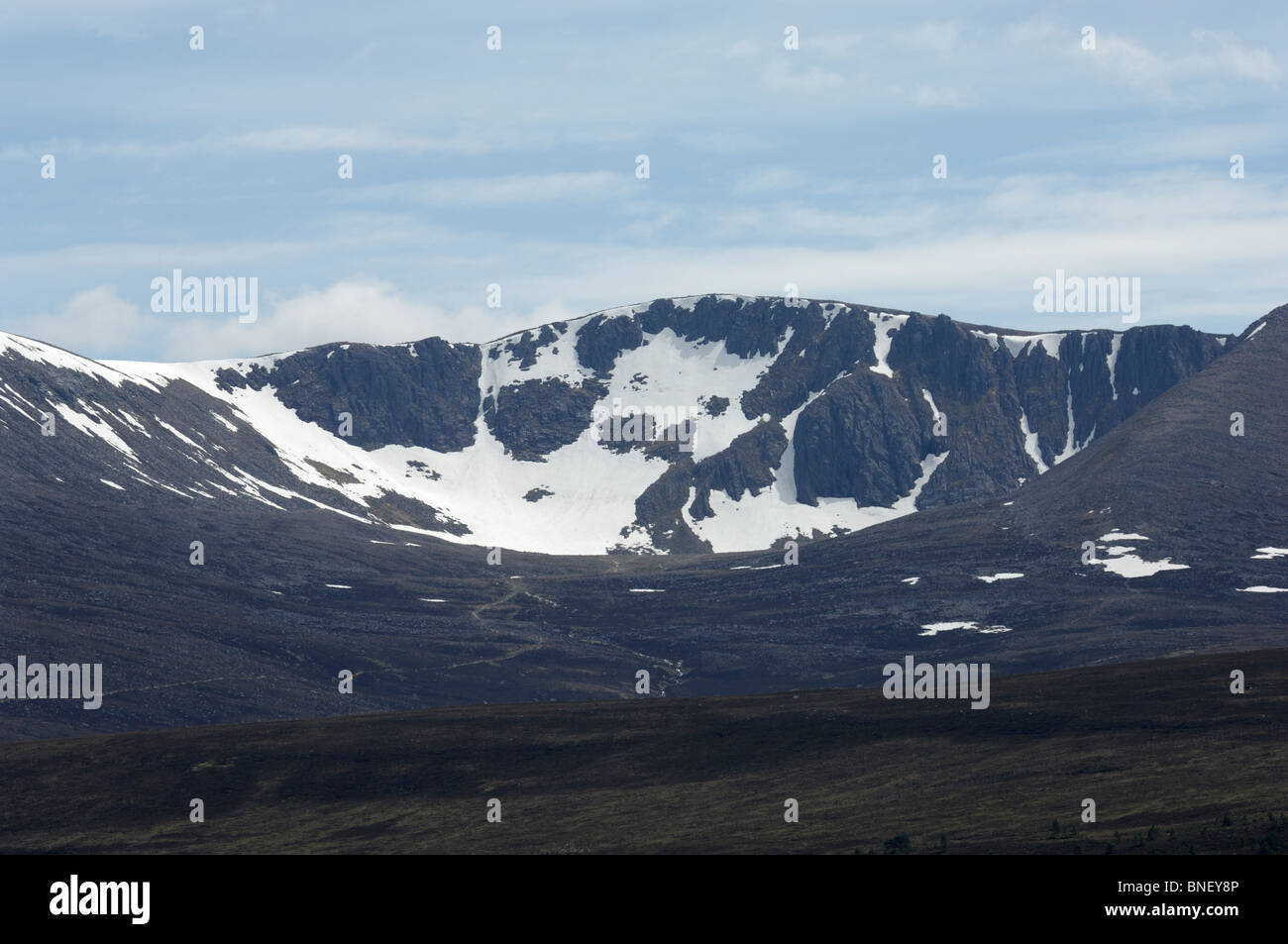 Coire an t-Sneachda in the Cairngorm National Park with snow on teh ground in early summer. Stock Photo