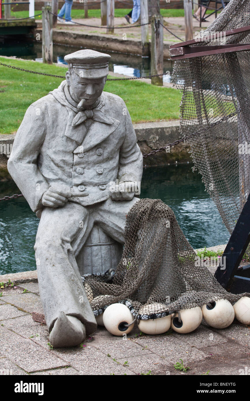 Tulip time festival Dutch Holland Michigan in USA with stone sculpture statue fisherman on street outddors nobody none no one hi-res Stock Photo