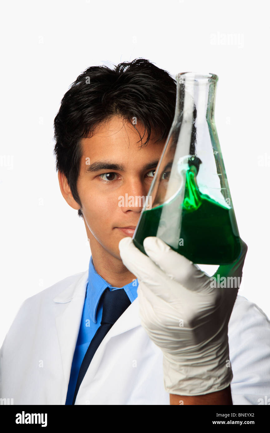 lab technician holding a flask with a fluid inside Stock Photo Alamy