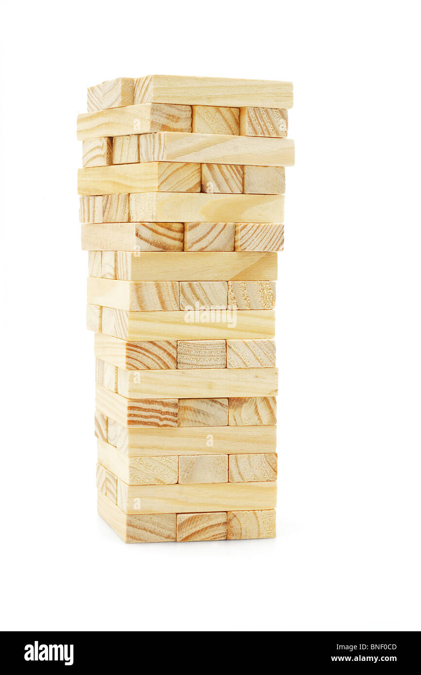 Wooden building blocks tower on white background Stock Photo