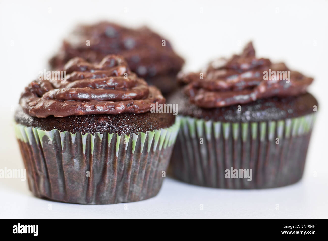 Homemade chocolate cupcakes on a white background. Stock Photo