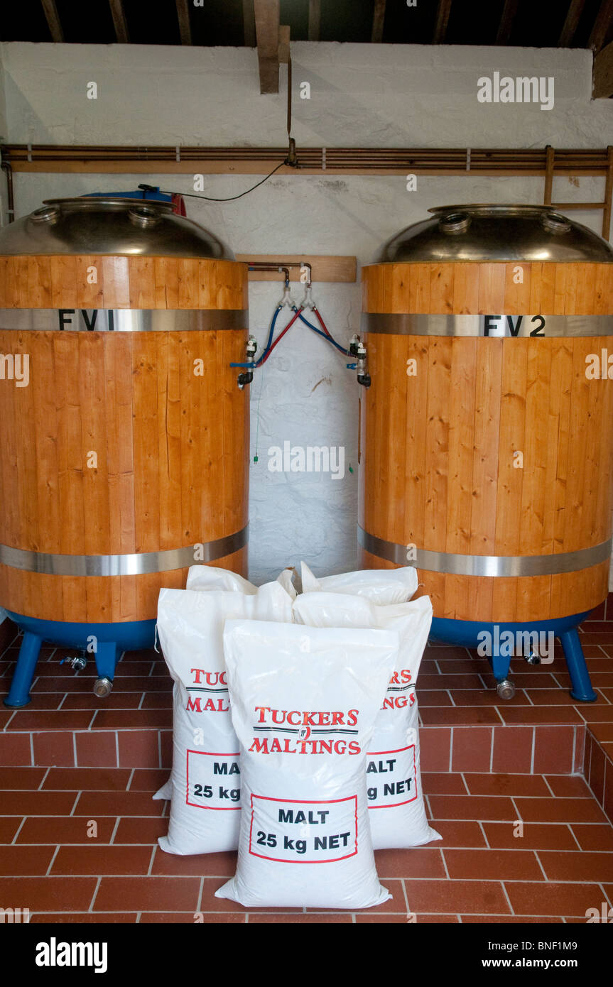 Brewing vessels - with sacks of malted barley - at the Star Inn's micro-brewer in Crowlas, Cornwall. Stock Photo