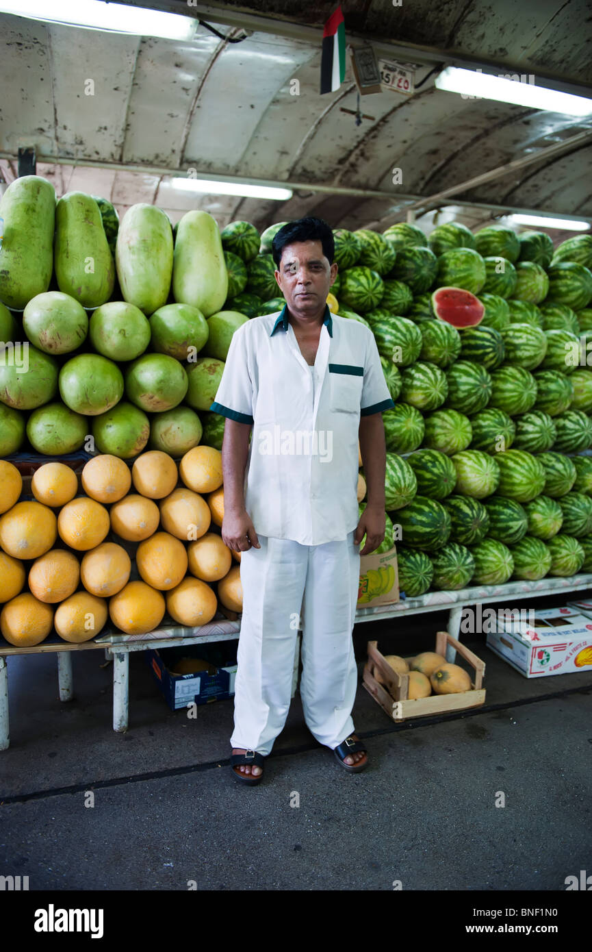 Stall holder at Dubai fruit and vegetable market, UAE Stock Photo Alamy