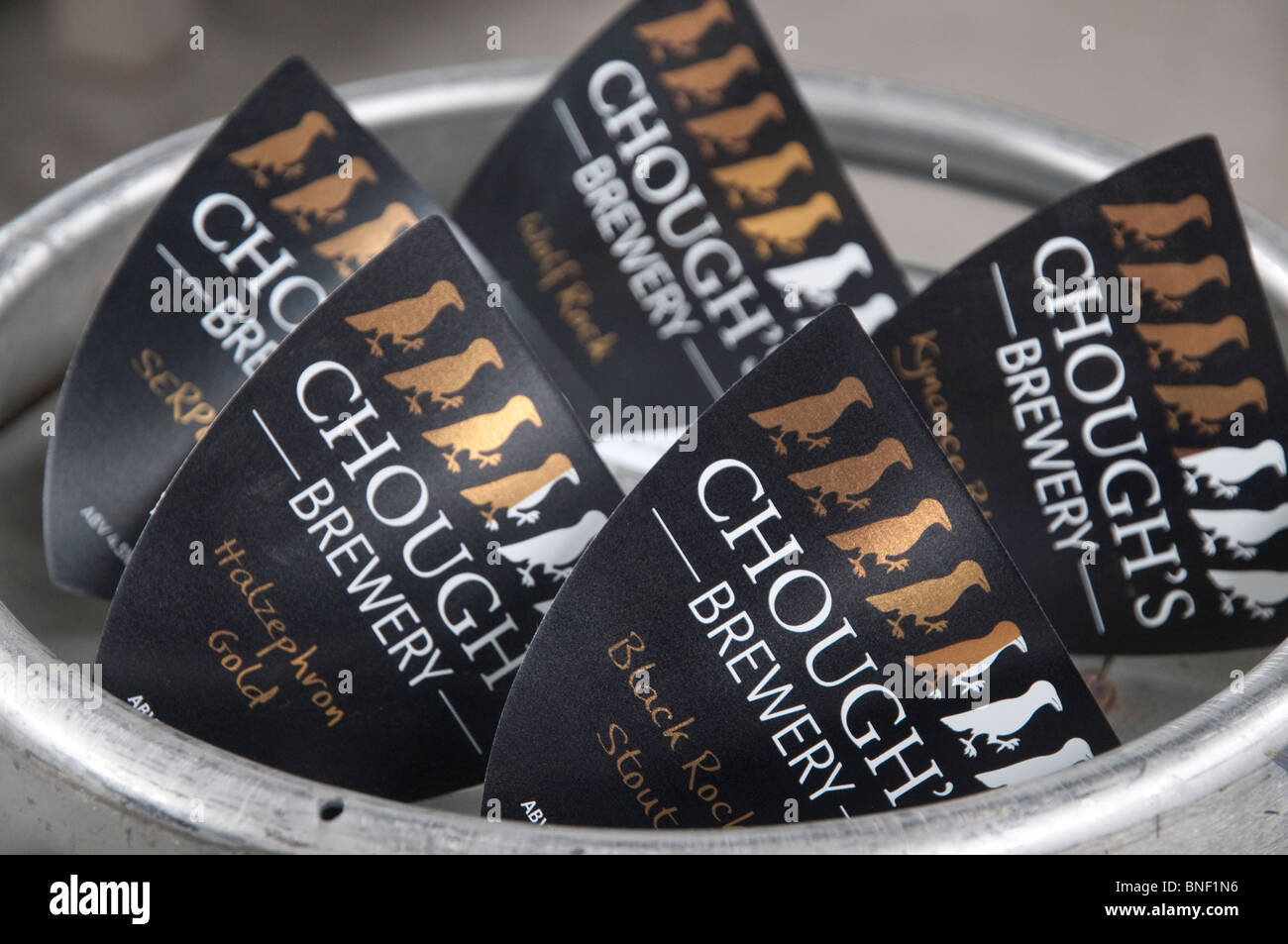 New design pumpclips from the Chough brewery, Cornwall, sitting on the top of a beer cask. Stock Photo