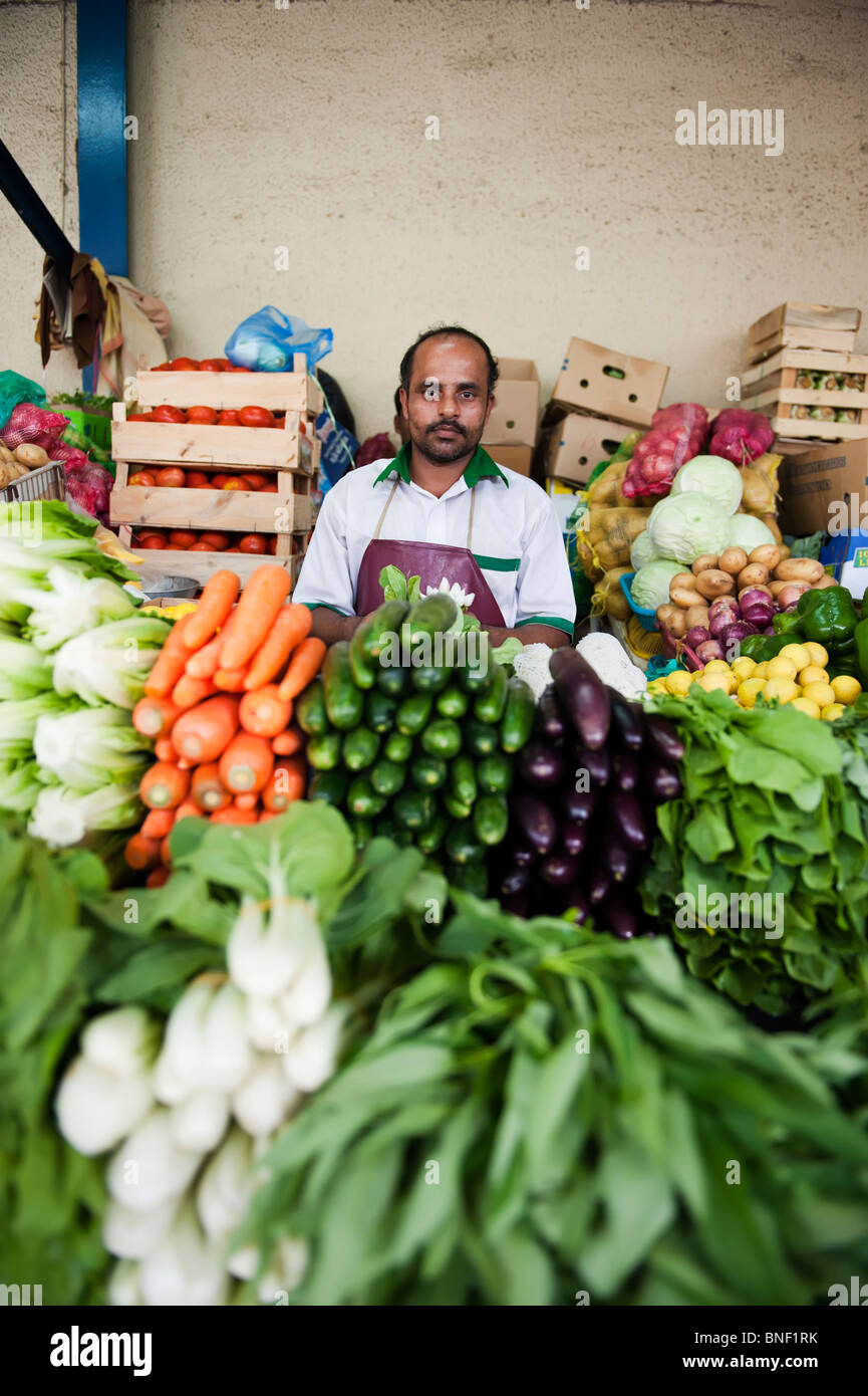 Market trader in Dubai vegetable market Stock Photo Alamy