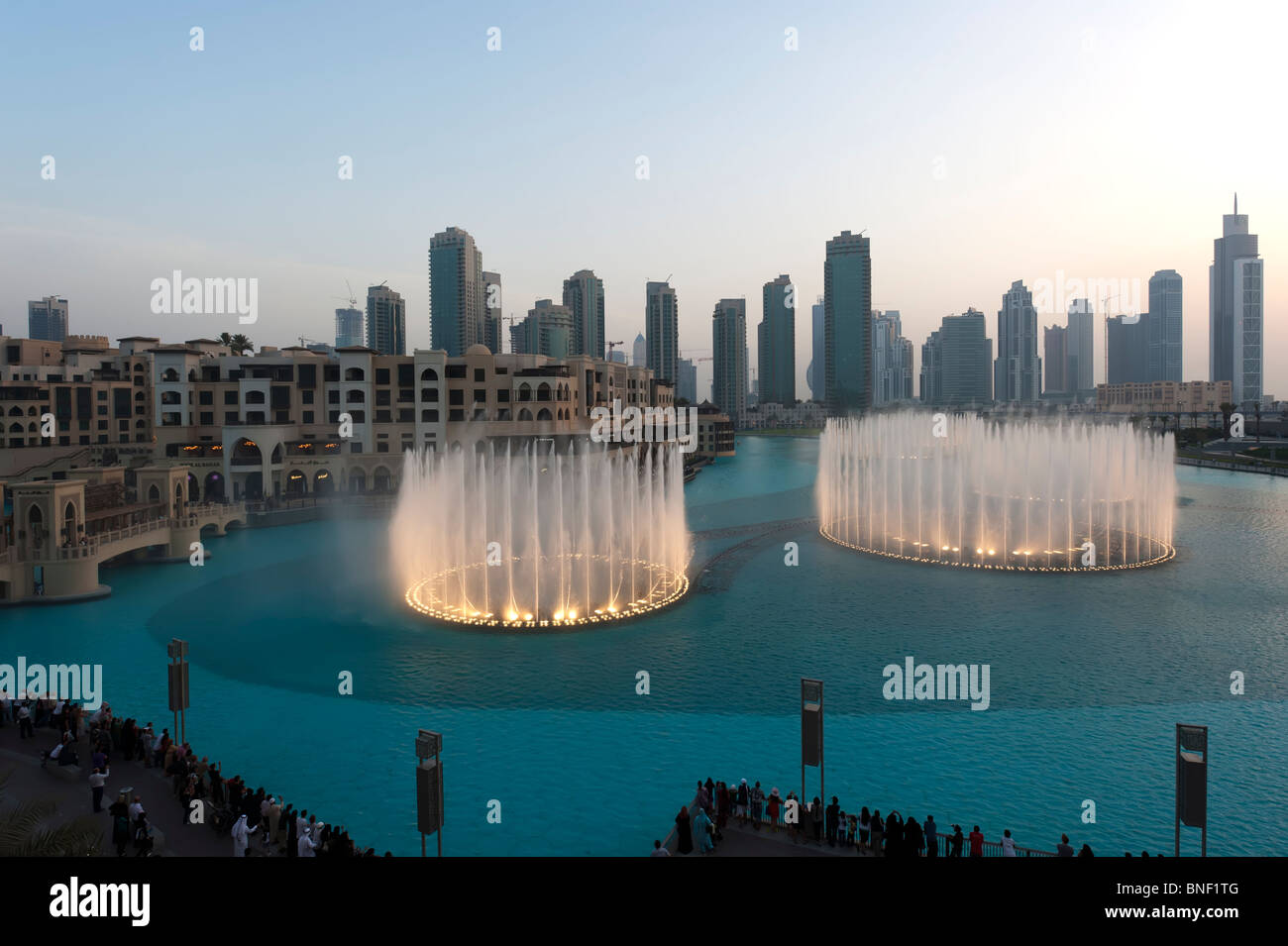 Evening image of the illuminated Dubai Fountains at Downtown Dubai Mall