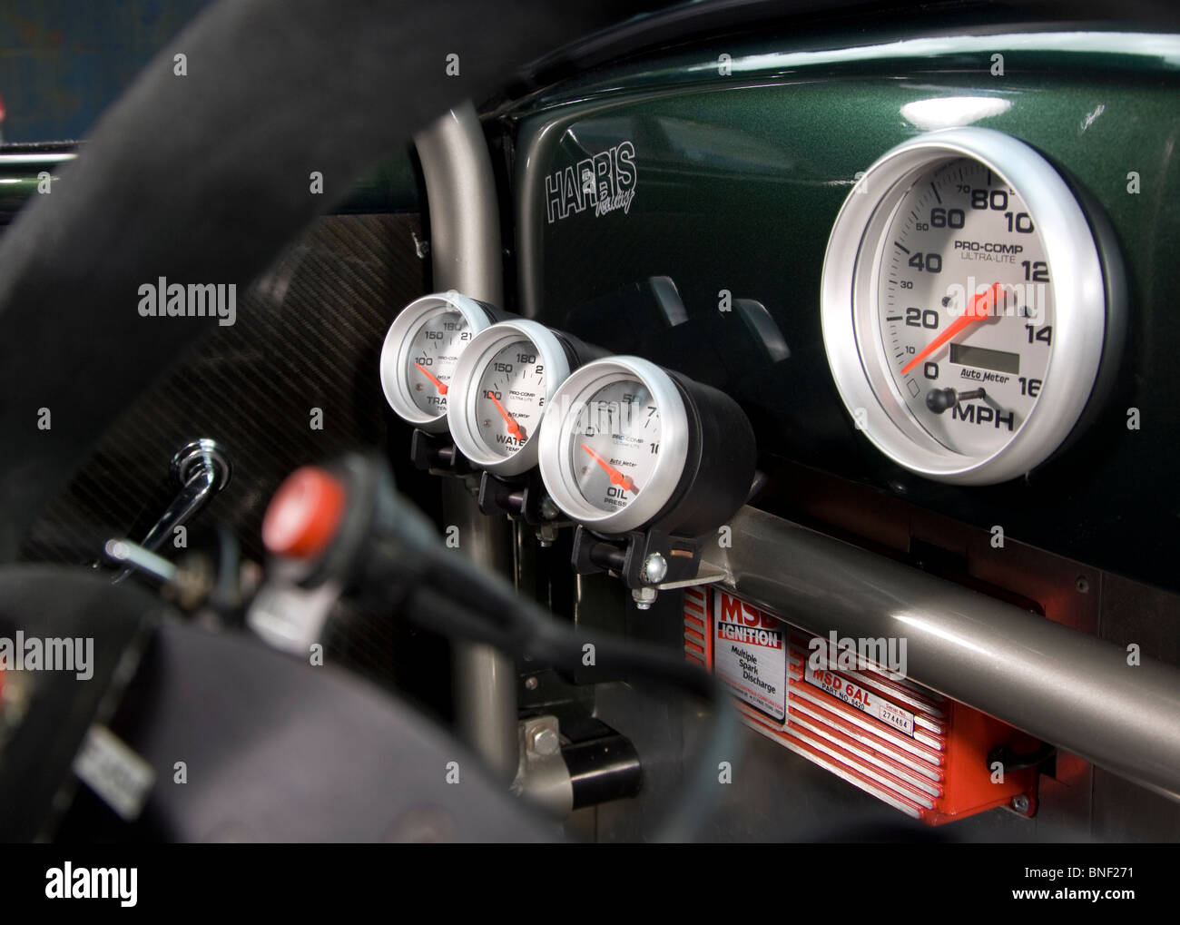 Dashboard gauges and dials temp, pressure, level and speed in a