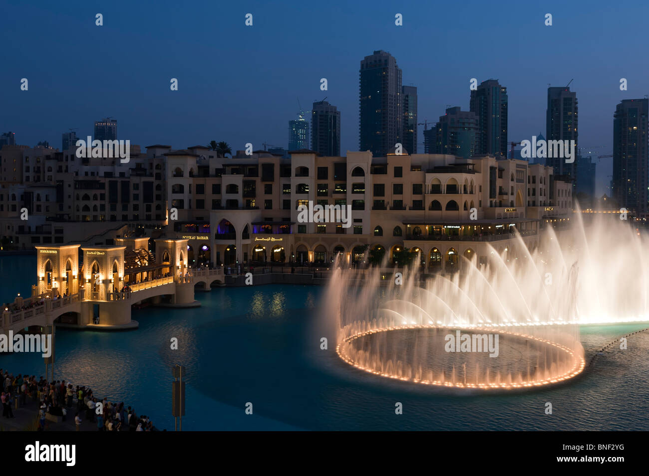 Evening image of the illuminated Dubai Fountains at Downtown Dubai Mall