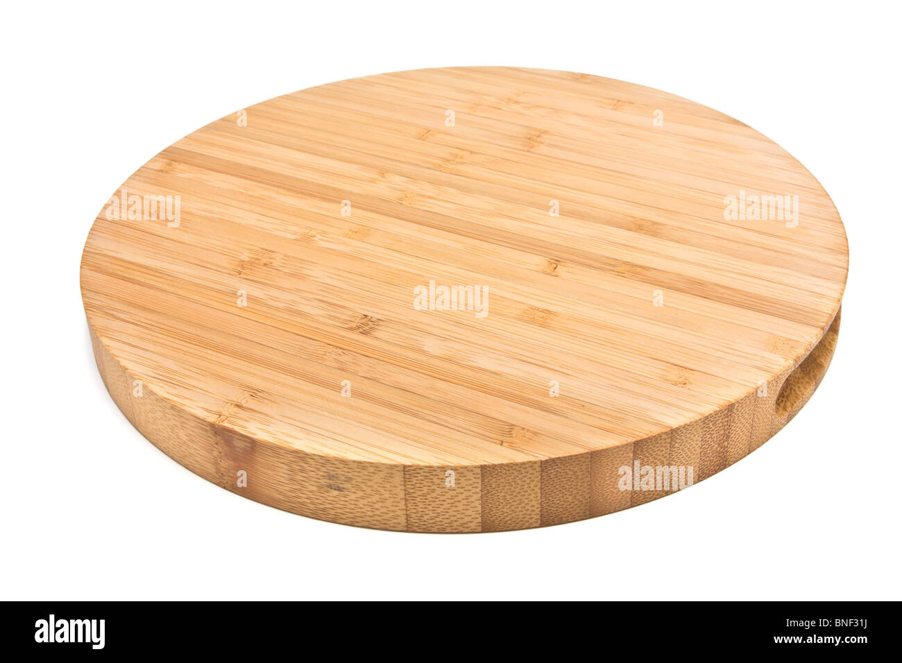 Round Bamboo Chopping Board from low perspective isolated against white background. Stock Photo