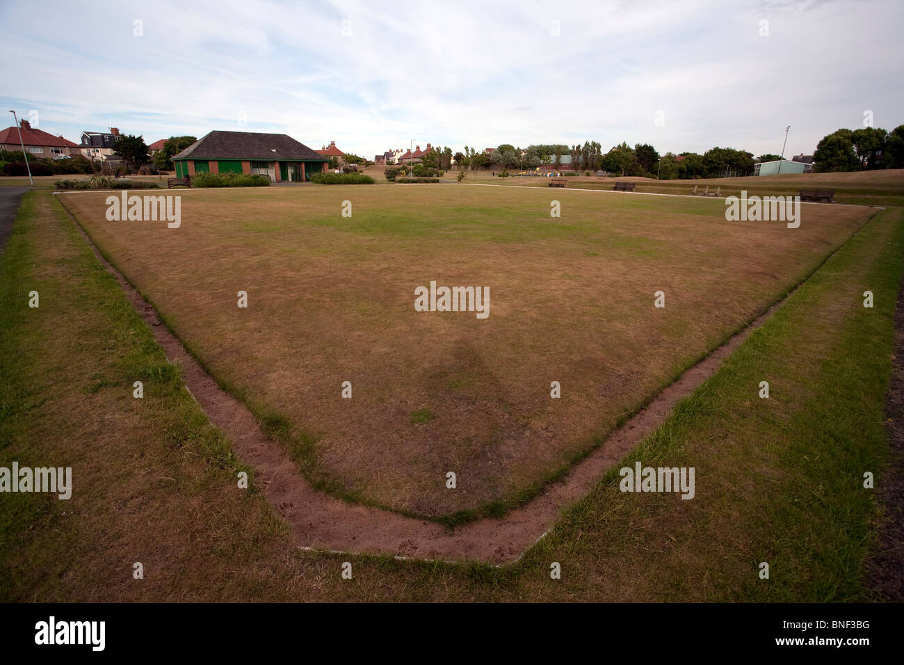 Hoylake bowling green in Queen's Park showing the effects of drought and a water shortage on the quality of the bowling surface. Stock Photo