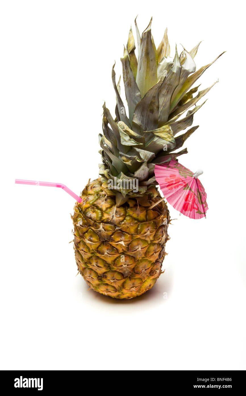 Pina Colada Pineapple Cocktail isolated against white background. Stock Photo