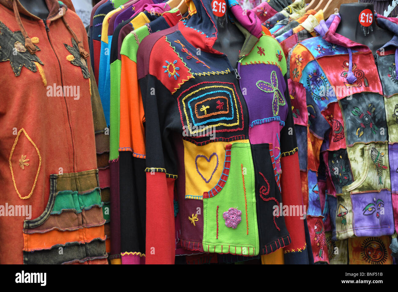 Colourful shirts on sale at Guilfest music festival Stock Photo