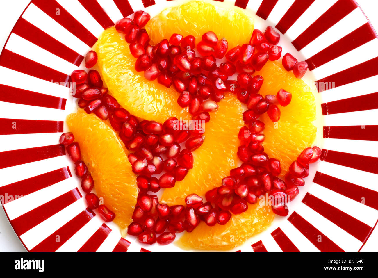 Freshly Prepared Healthy Fresh Pomegranate and Orange Salad After Dinner Dessert Served on A Plate With No People As A Flat Lay Close Up Stock Photo