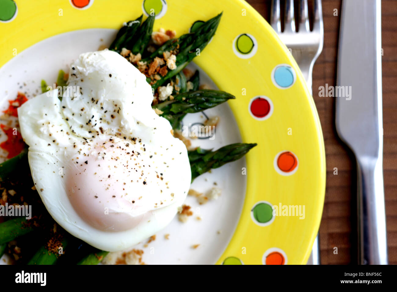 Fresh Healthy Poached Egg with Asparagus Served On A plate With No People Stock Photo