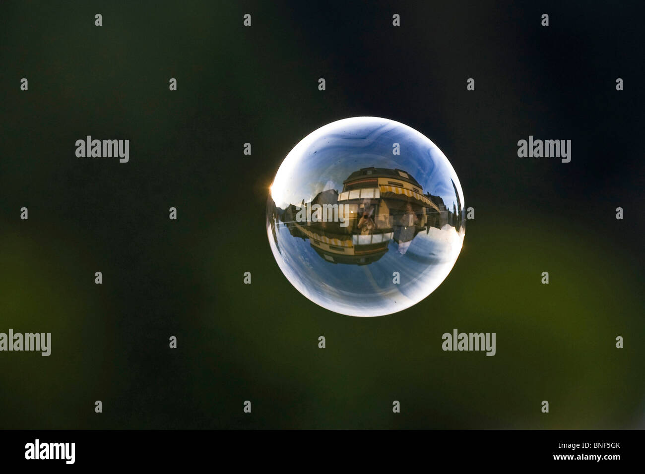 residential buildings reflected in a flying soap bubble, Germany Stock Photo