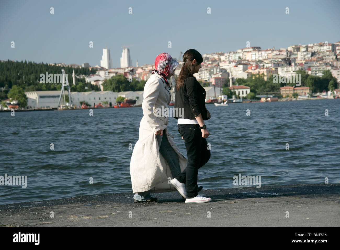 Turkish girls walking by the Golden Horn, Istanbul, Turkey Stock Photo