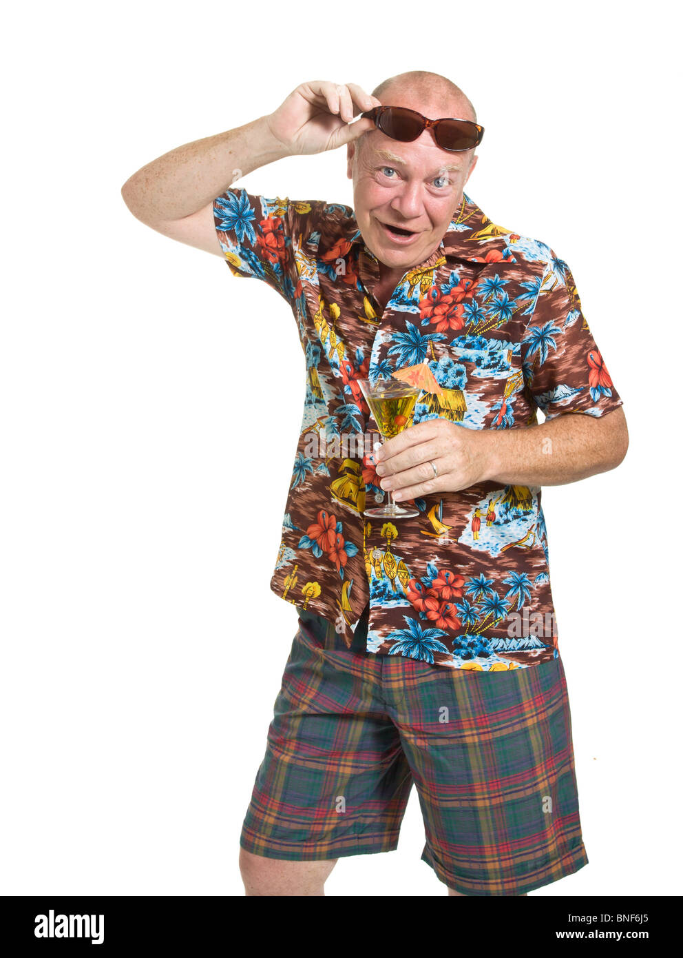 Expressive old man in loud shirt holiday concept isolated against white. Stock Photo