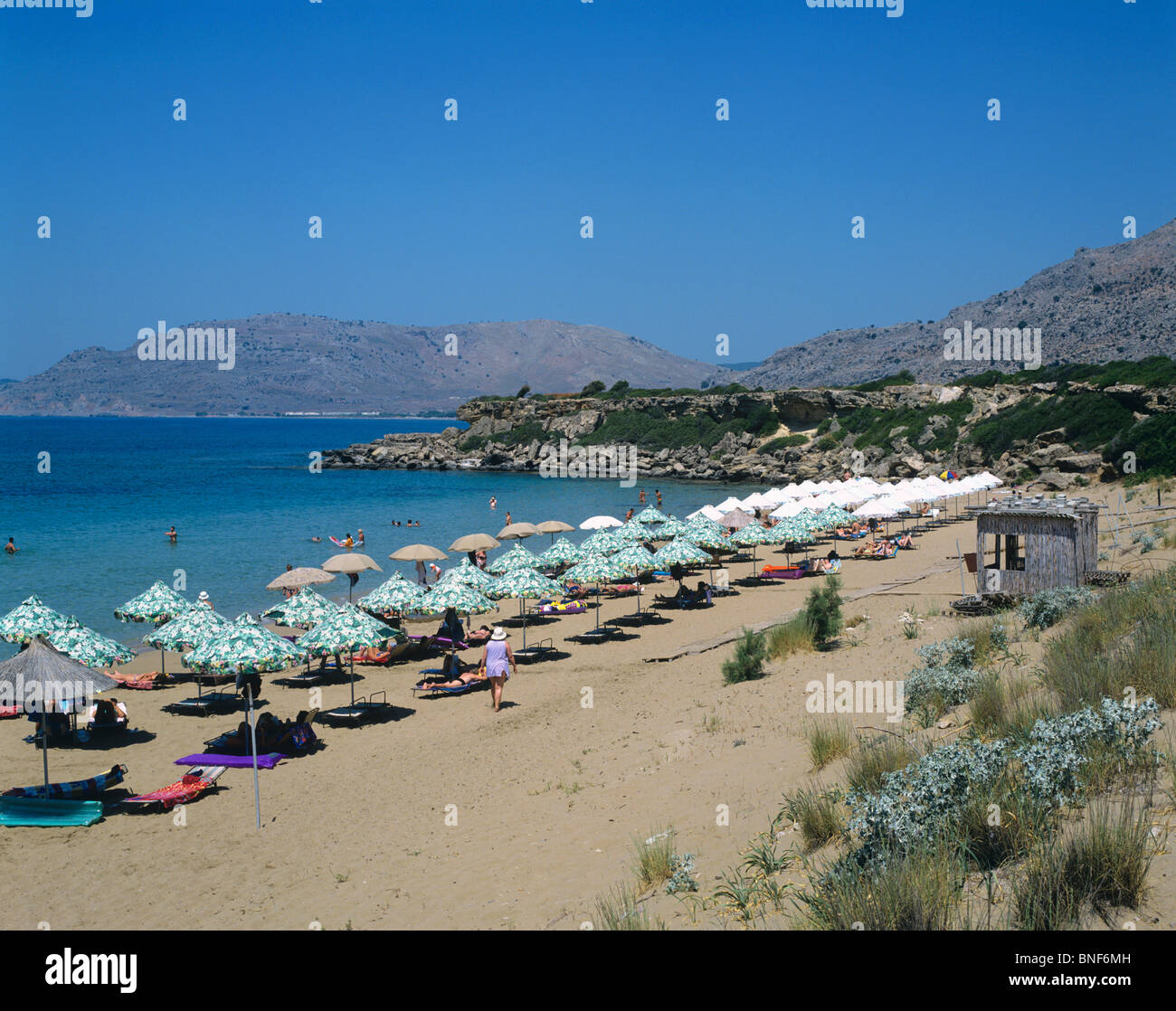 Picturesque beach scene at the resort of Pefkos in southern Rhodes near Lindos Stock Photo