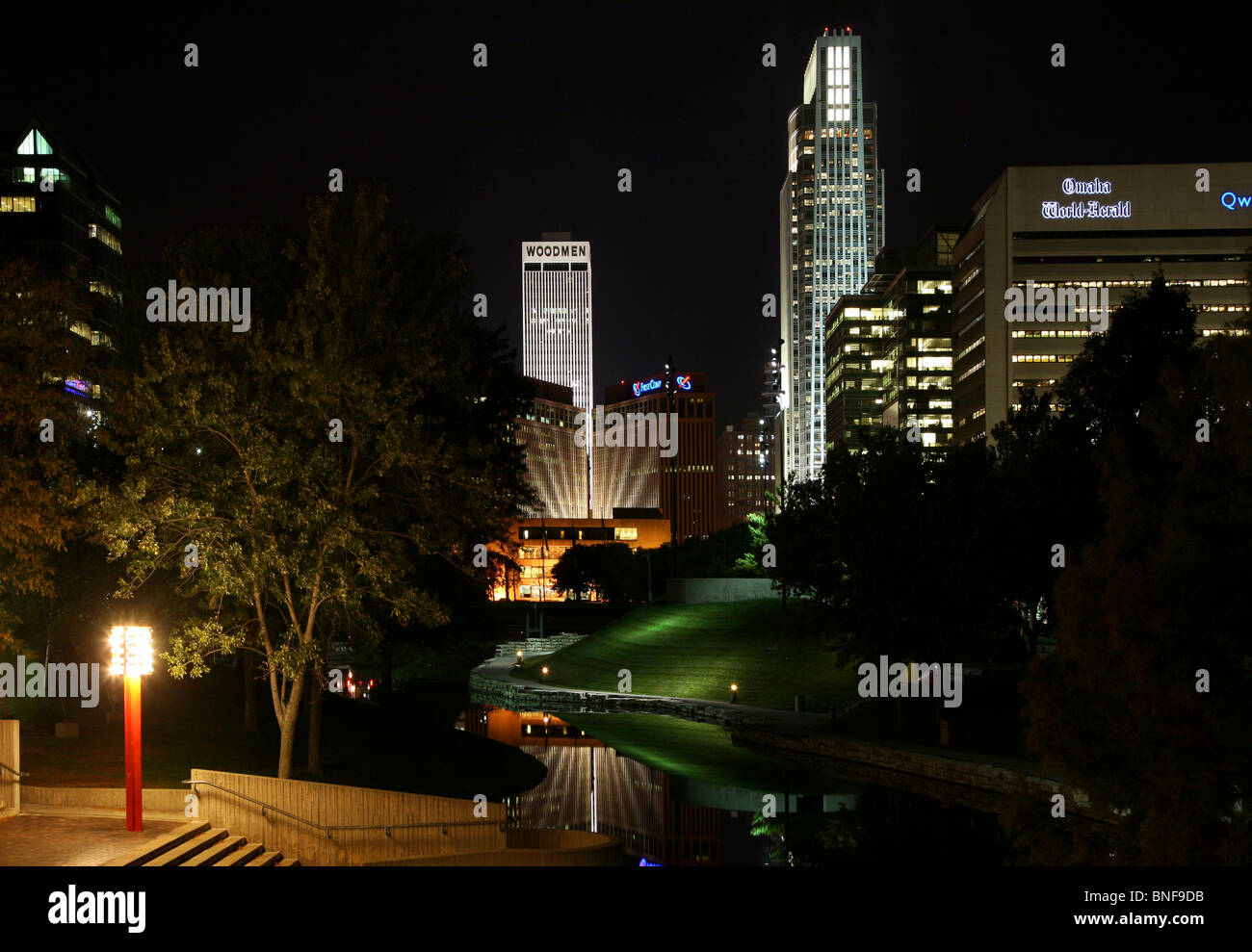 USA, Nebraska, Omaha, Park at night with skyscrapers in background