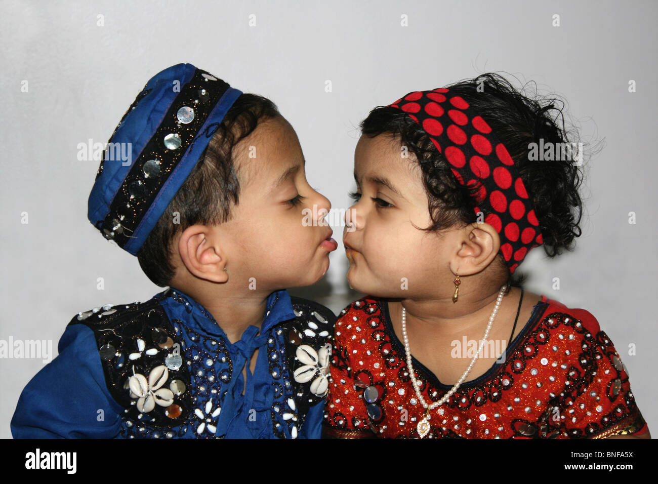 Innocent kiss. Indian boy and girl in traditional Gujarathi outfits. Place- Pune (Maharashtra) Stock Photo