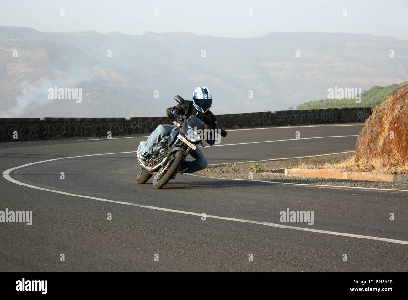Perfect Cornering Amateur Rider from Pune.Trying his cornering skills on terrific turns of Mutha ghat. Stock Photo