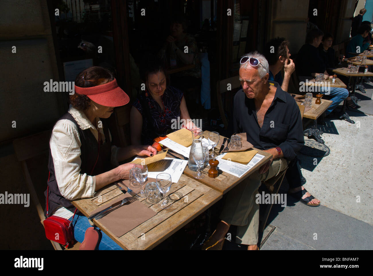 People reading menus Paris France Europe Stock Photo - Alamy