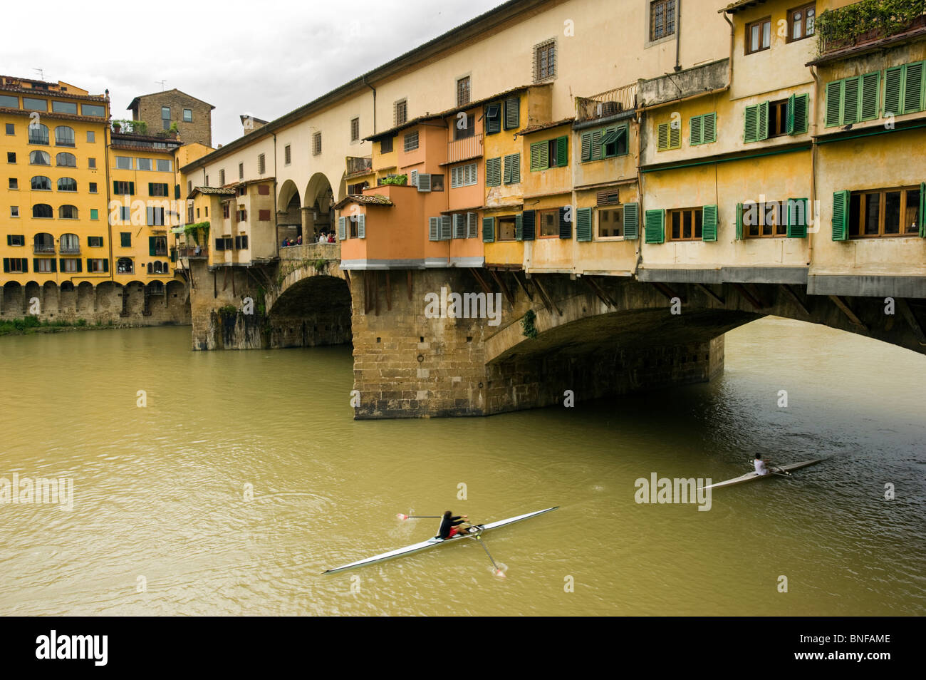 The Ponte Vecchio, Medieval bridge over the Arno River, in Florence, Italy. Stock Photo