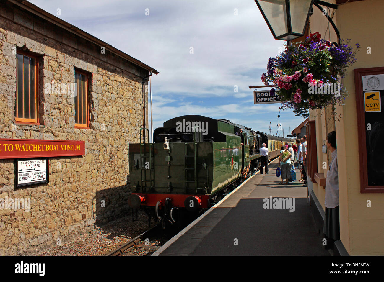A steam train hauled by rebuilt Bulleid locomotive no 34046 arrives at Watchet railway station on the West Somerset Railway Stock Photo
