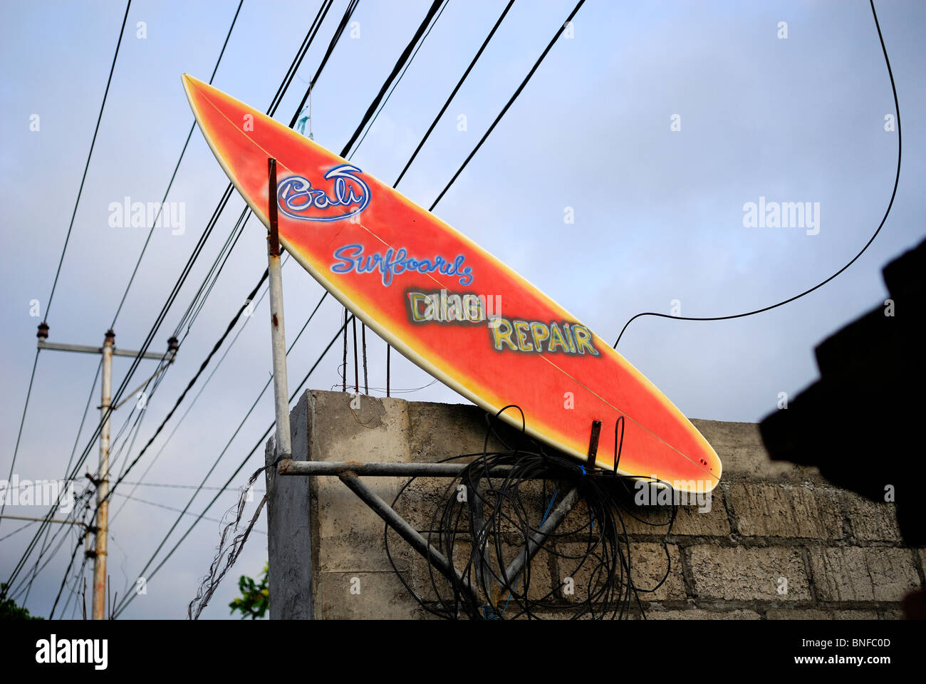 Surfboard as sign advertising surfboard repairs. Sanur, Bali, Indonesia